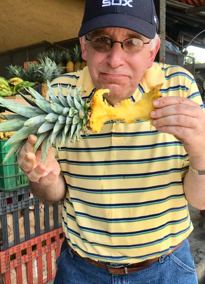Man eat pineapple