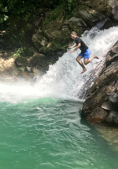 Jump of cliff into pool Panama