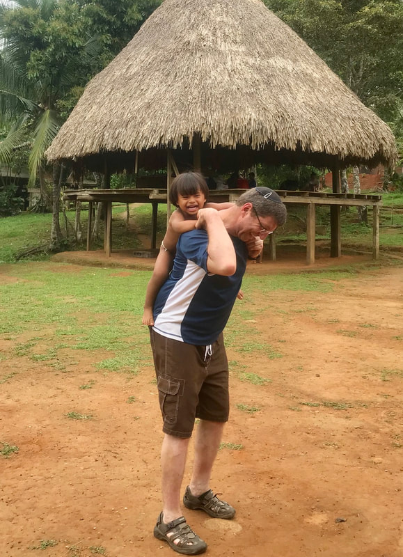 tourist play with panamanian child
